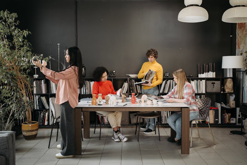 Diverse team collaborating in a modern office setting, engaging in creative discussion and planning.